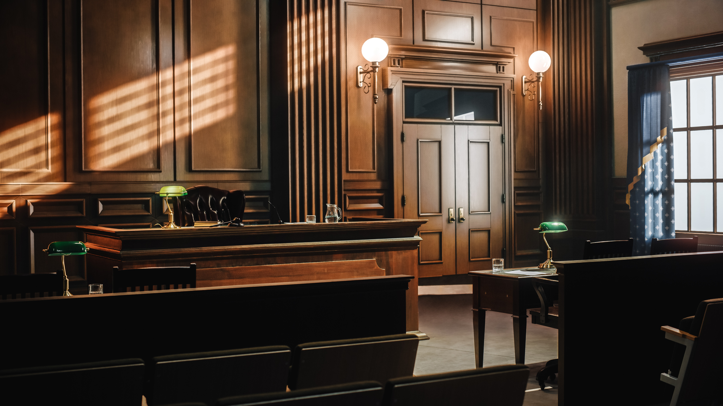 Wood-paneled courtroom interior with judge's bench
