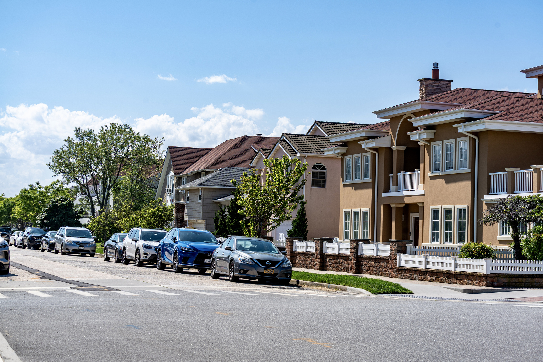 Quiet Long Island residential neighborhood street with homes